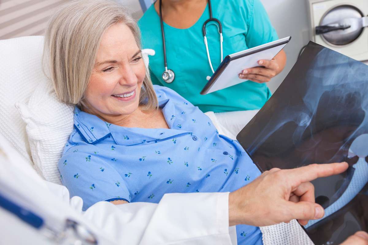 Doctor explaining x-rays to patient